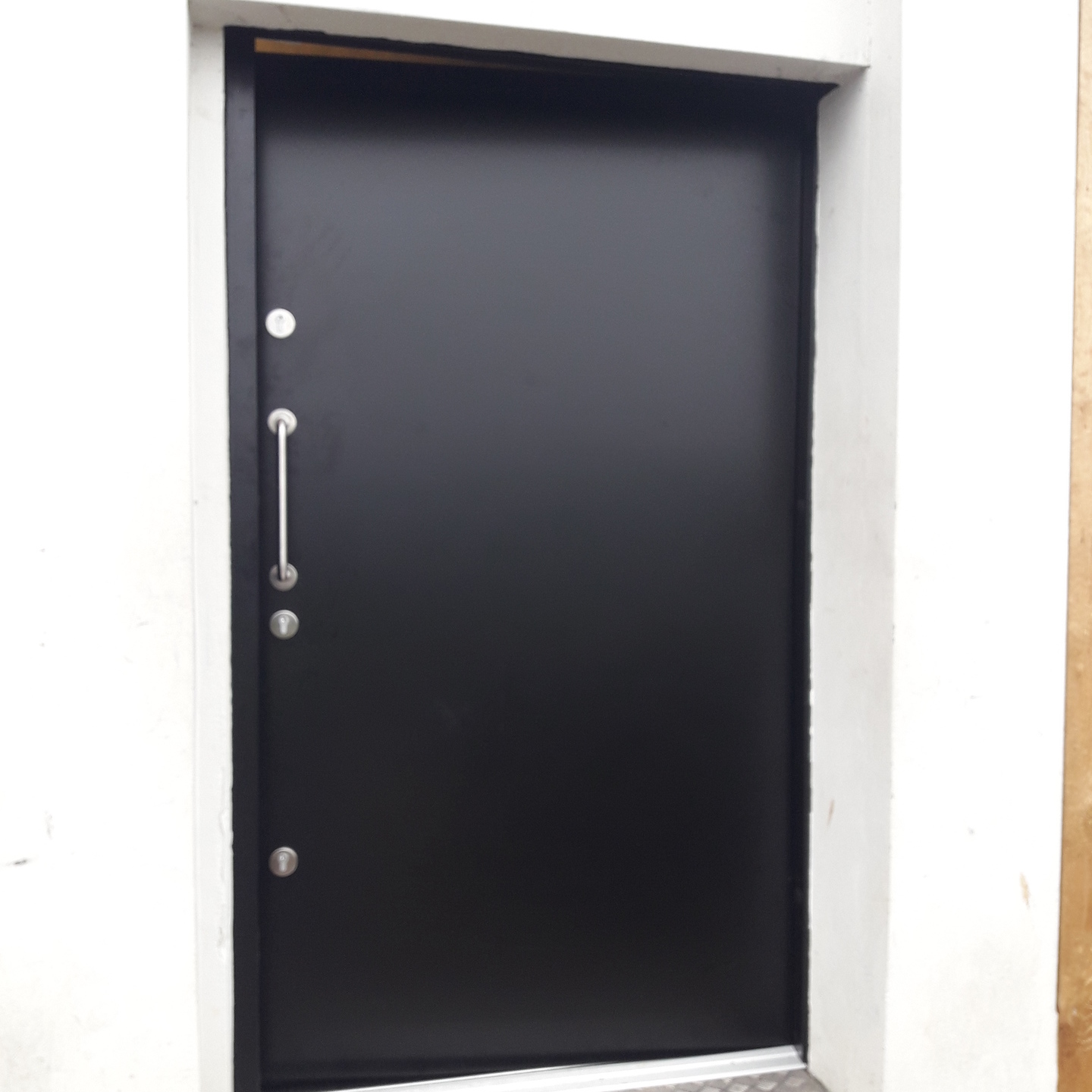 Steel security door in black. Triple Lock system