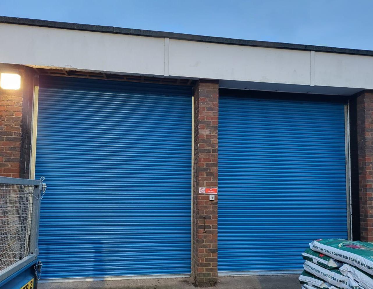 Pair of roller shutters installed in Corby