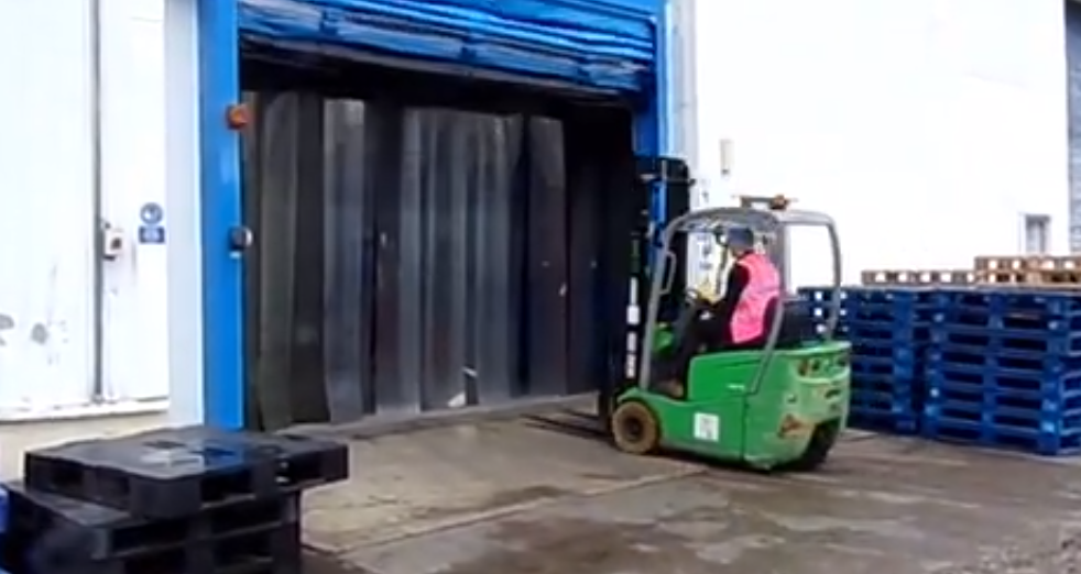 Man demonstrating retractable bollard installation from Stanair Industrial Doors Limited