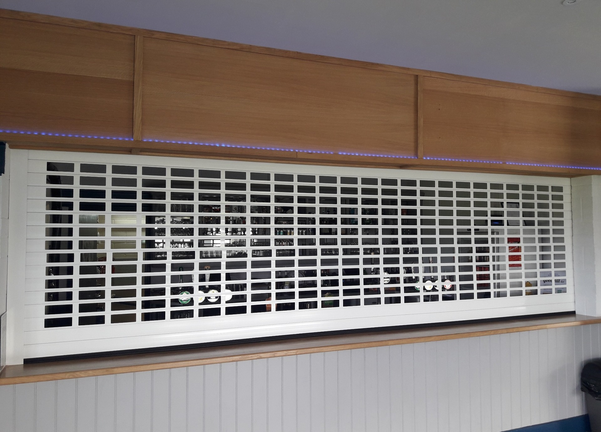White bar shutters manually operated
