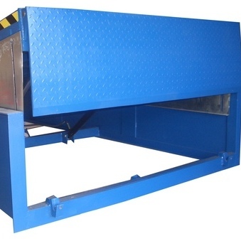 Hinged Lip Dock Leveller in raised position. Blue powder coating with toe guard
