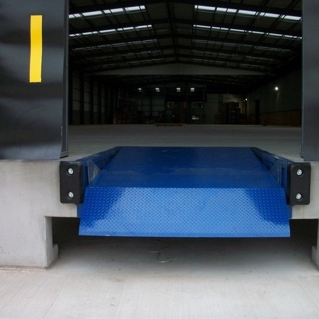 Telescopic Hinged Lip Dock Leveller in closed position over Docking Bay Pit