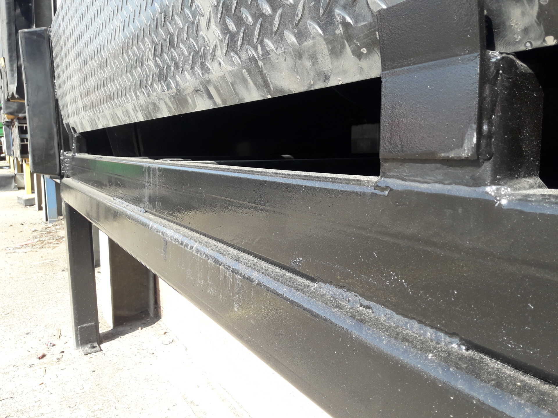 Close up of Stanair installed, repaired and serviced Fold down dock leveller in black