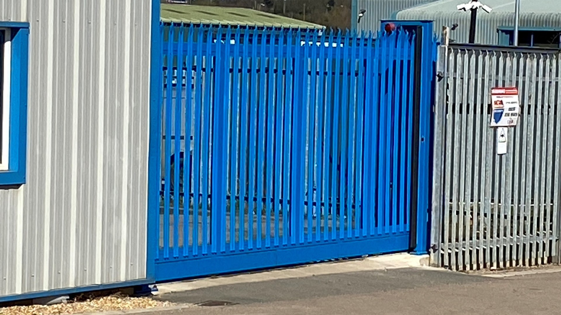 Blue Electronic Sliding Gate with Warning Klaxon and Safety Edge and photocells installed