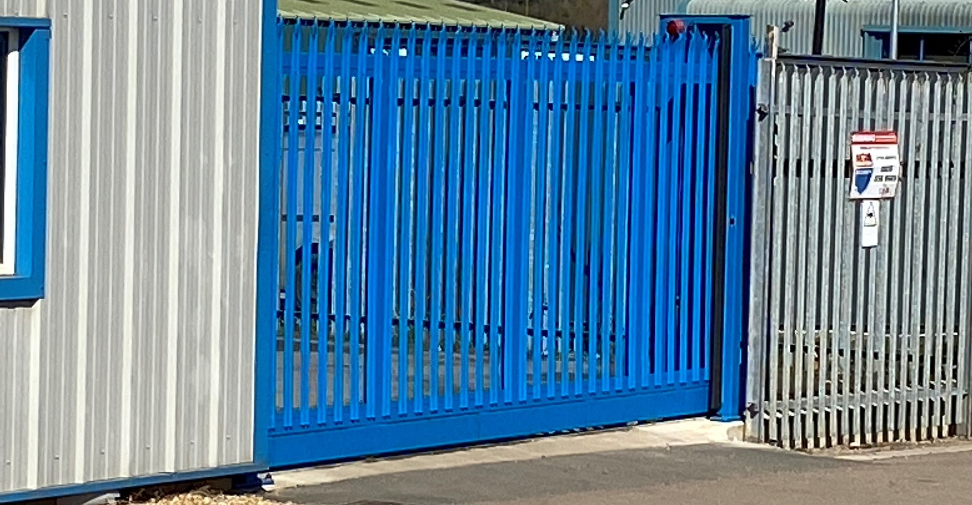 Open Steel gate with Stanair car in the distance