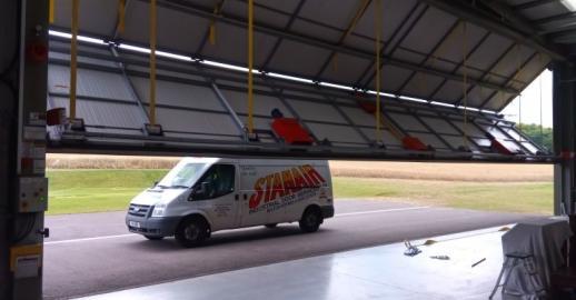 Large Folding Door to an air craft hangar as installed and maintained by Stanair Industrial Doors Ltd