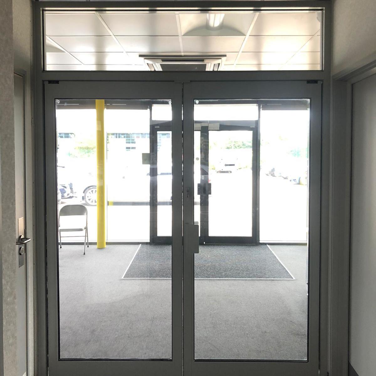 Double leaf, full vision Aluminium entrance doors as installed by Stanair Industrial Doors