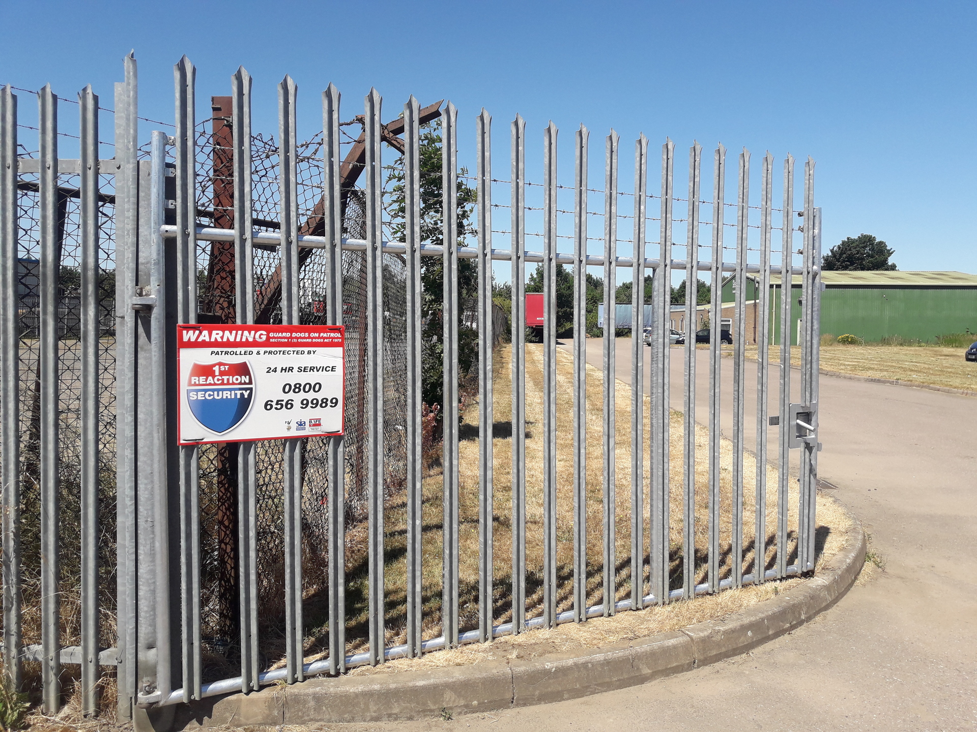 Steel swinging gates with manual locking system in galvanised steel as installed by Stanair Industrial Doors
